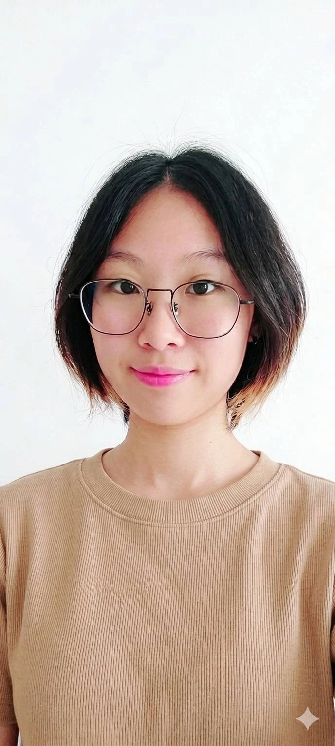 Emma Huang wearing glasses and a beige top