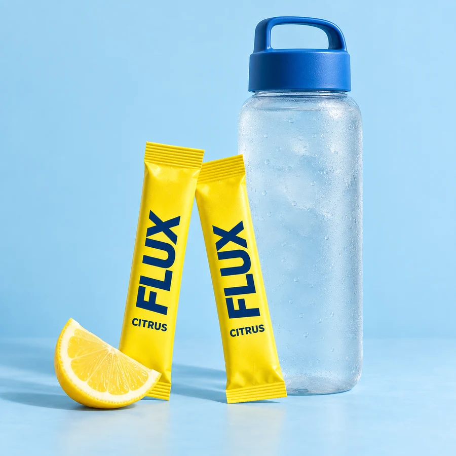 FLUX citrus drink-mix sachets beside a reusable bottle