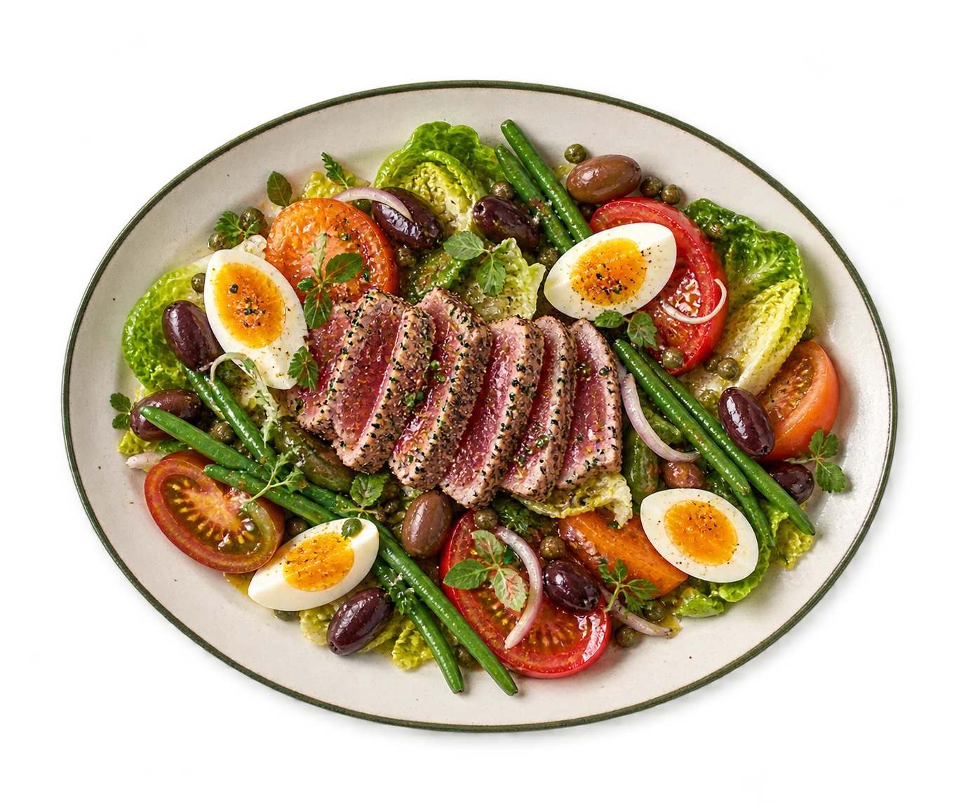 Overhead plate of salade niçoise with heirloom tomatoes and tuna